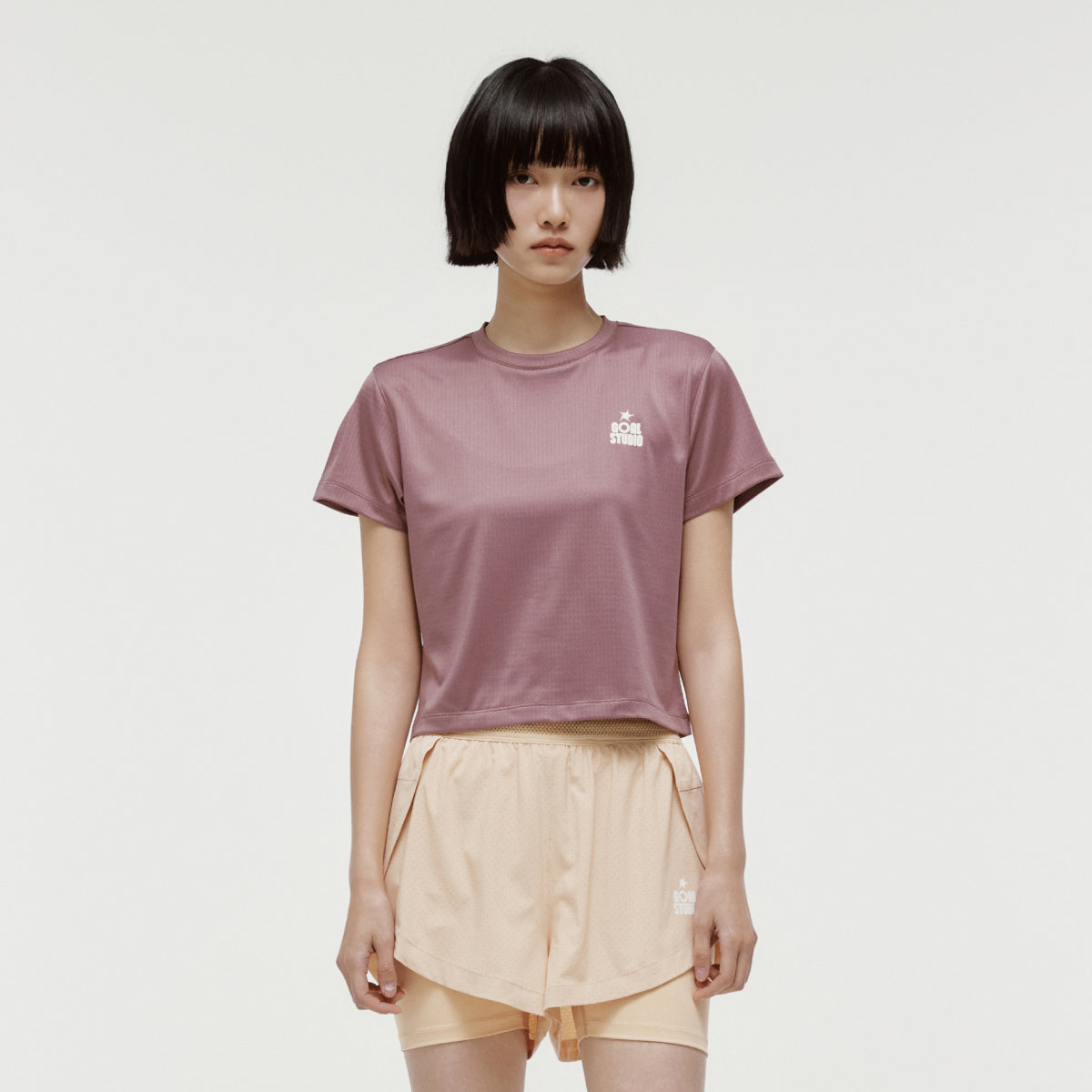 W'S TRACK GOAL LOGO CROP TEE - BRICK