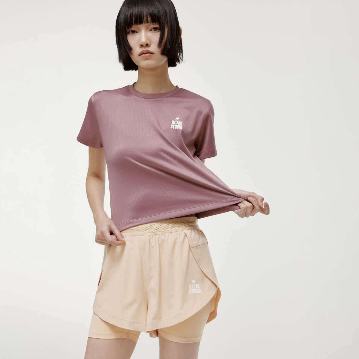 W'S TRACK GOAL LOGO CROP TEE - BRICK
