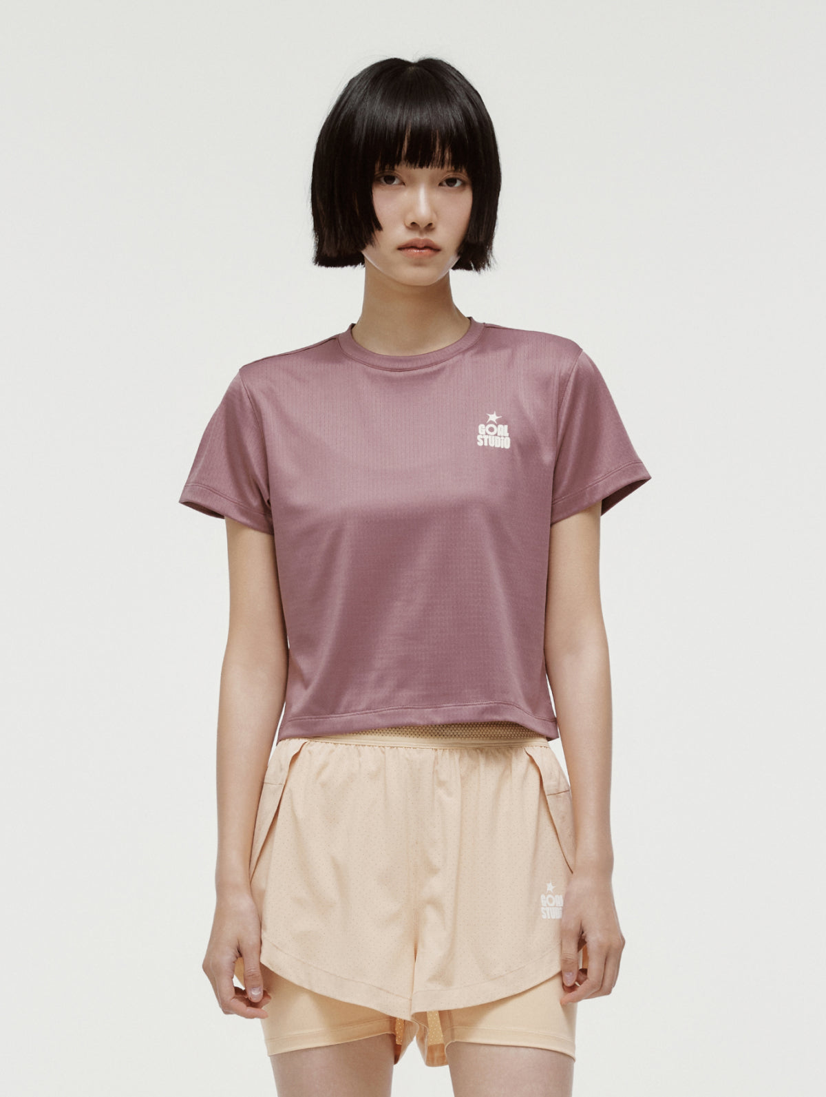 W'S TRACK GOAL LOGO CROP TEE - BRICK