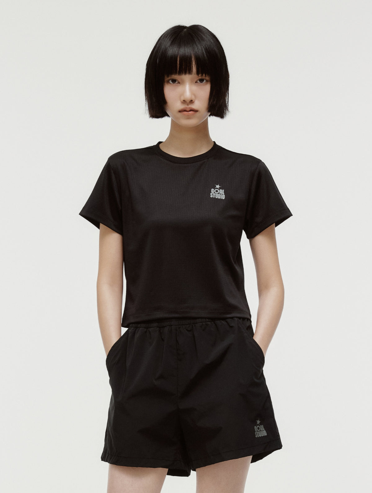 W'S TRACK GOAL LOGO CROP TEE - BLACK